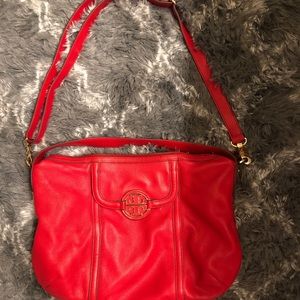 A red Tory Burch bag